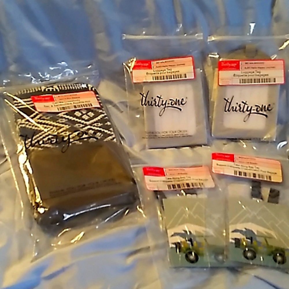 Thirty one lot with crossbody, 2 take along tags and 2 light grey luggage tags